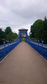 Gazebo by bridge against sky