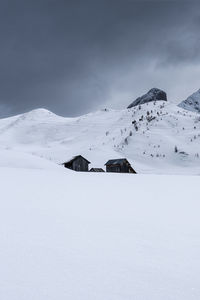 Scenic view of snowcapped mountains against clear sky