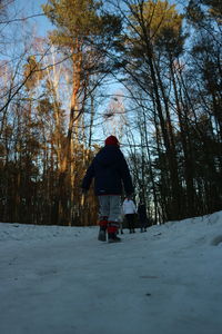 Rear view of man in snow