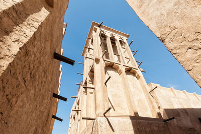 Low angle view of bell tower against sky