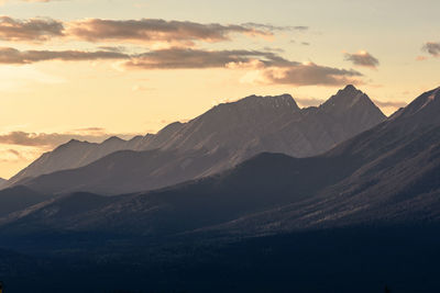 Scenic view of mountains against sky during sunset