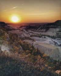 Scenic view of landscape against sky during sunset