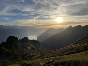 Scenic view of mountains against sky during sunset