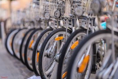 Close-up of bicycles parked on road