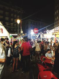 Crowd at concert in city at night