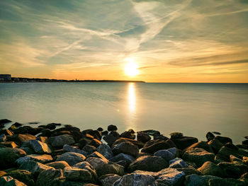 Scenic view of sea against sky during sunset