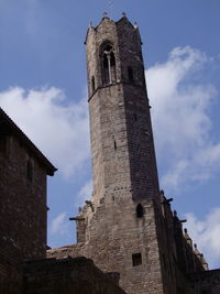 Low angle view of bell tower against sky