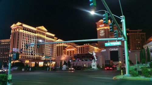 Low angle view of illuminated street light at night