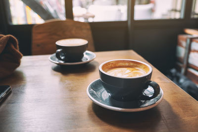 Close-up of coffee cup on table