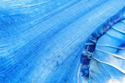 Blue abstract acrylic painting color texture on white paper background by using inkblot method