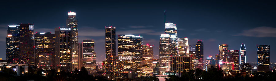 Illuminated buildings in city at night