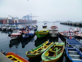 Boats moored at harbor