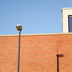 Low angle view of street light against clear sky