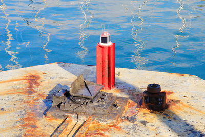 High angle view of garbage can on lake