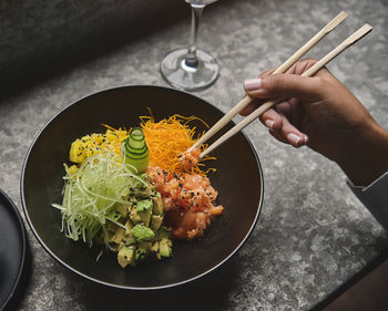 Cropped hand of person preparing food