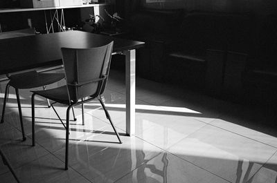 Empty chairs and table in restaurant