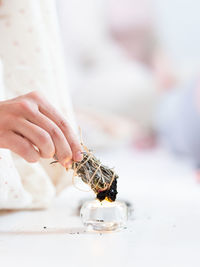 Midsection of woman holding wedding rings