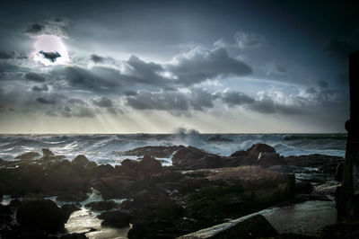 Scenic view of sea against cloudy sky