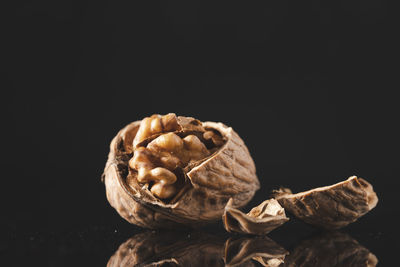 Close-up of cupcake on table against black background