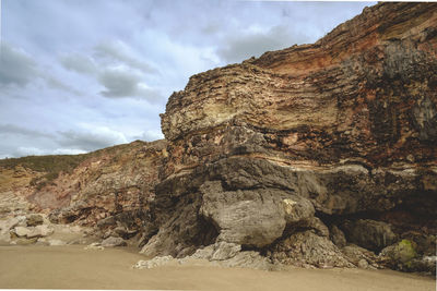 Rock formation on land against sky