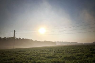 Scenic view of field against sky during sunset