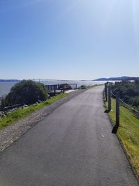 Empty road against clear sky