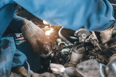 Midsection of man working at workshop