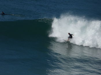 People surfing in sea