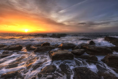 Scenic view of sea against sky during sunset