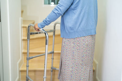 Midsection of woman standing in gym