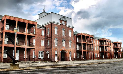 Exterior of old town against cloudy sky