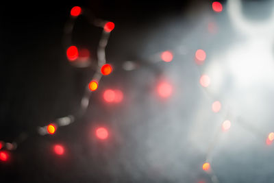 Defocused image of illuminated city at night