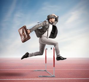 Full length of young man jumping against sky