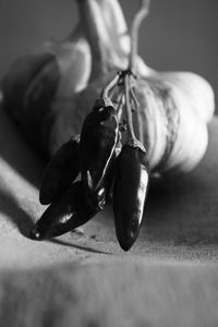 Close-up of garlic and red pepper on table