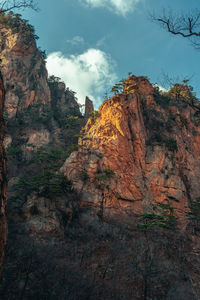 Rock formations on mountain against sky