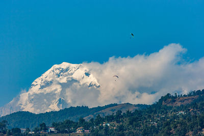 Scenic view of mountains against sky during winter