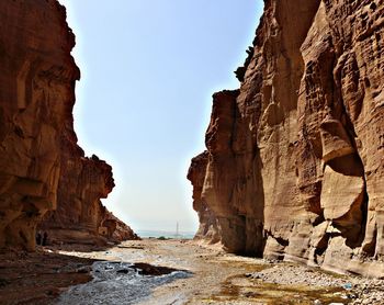 Low angle view of rock formations against sky