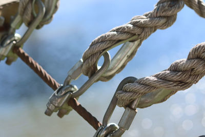 Close-up of rope tied to metal