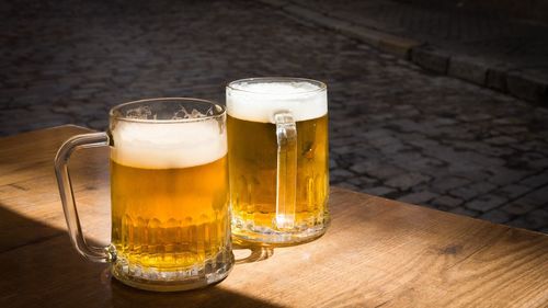 Glass of beer on table