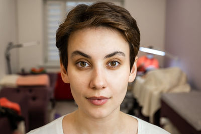 Caucasian woman before procedure in beauty salon. 