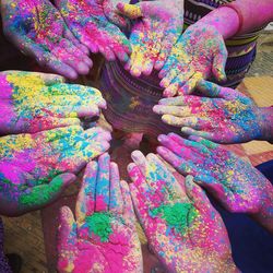 High angle view of multi colored pencils in hand