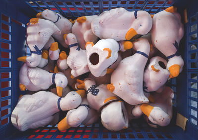 Close-up of duck figurines in basket