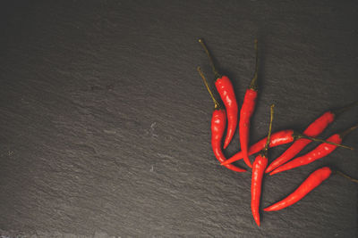 High angle view of red chili peppers on table