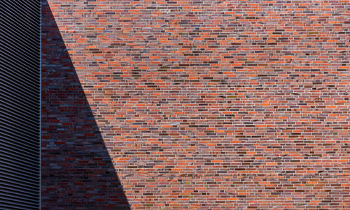 Low angle view of brick wall