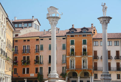 Low angle view of buildings against clear sky