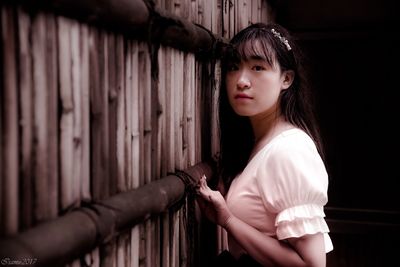 Side view of young woman standing outdoors