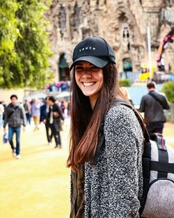 Portrait of smiling woman wearing cap