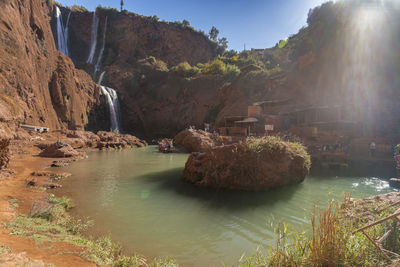 Panoramic view of river amidst mountains against sky