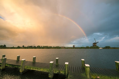 Rainbow over sea against sky