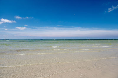 Scenic view of sea against blue sky